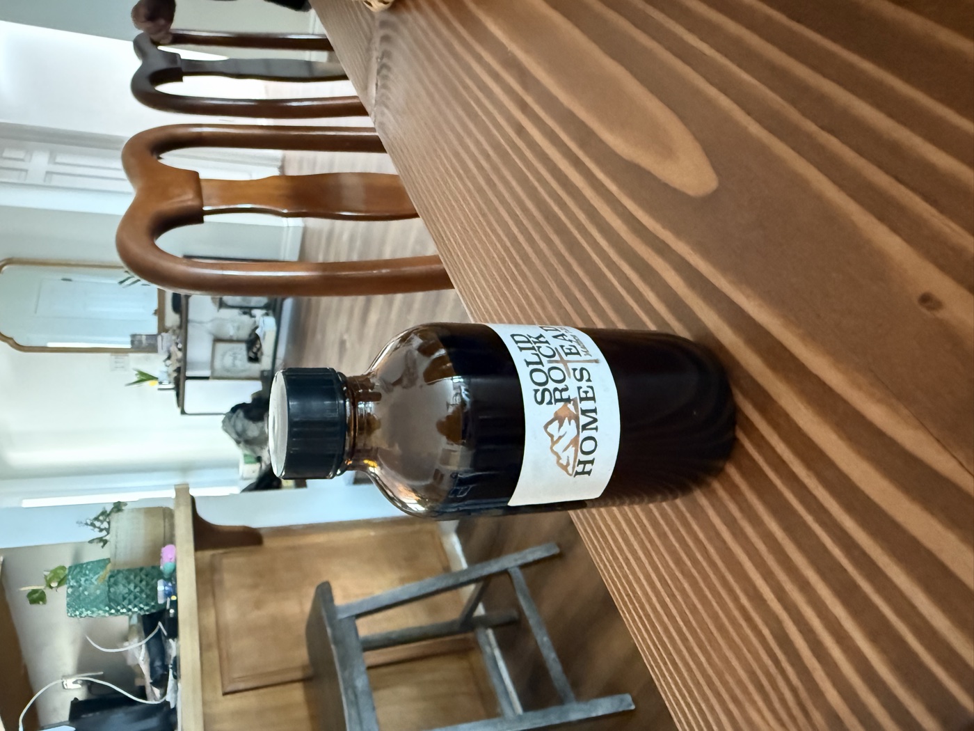 A finished bottle of Solid Rock Homestead homemade vanilla extract